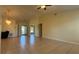 Bright living room featuring tile floors, neutral paint, and a chandelier at 6654 Hiawassee Meadows Dr, Orlando, FL 32818