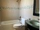 Bright bathroom offers a clean design with a shower-tub combination and stylish glass bowl sink at 702 Palenci Ct, Winter Springs, FL 32708