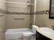 Cozy bathroom featuring a shower-tub combination and stylish tile accents, perfect for relaxation at 702 Palenci Ct, Winter Springs, FL 32708