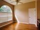 Bright bedroom featuring a ceiling fan, large window and warm neutral paint at 702 Palenci Ct, Winter Springs, FL 32708