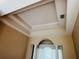 Detailed tray ceiling with layered design and recessed lighting for a modern touch at 702 Palenci Ct, Winter Springs, FL 32708