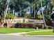 Elegant community sign for Seville Chase, surrounded by well-maintained landscaping at 702 Palenci Ct, Winter Springs, FL 32708