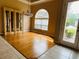 Dining area with hardwood floors, a chandelier, a china cabinet, and natural light at 702 Palenci Ct, Winter Springs, FL 32708