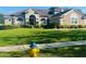 Charming single Gathering home with lush front yard, colorful landscaping, and attractive fire hydrant at 702 Palenci Ct, Winter Springs, FL 32708