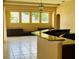 Modern kitchen with custom wooden cabinets, granite countertops and a view to the breakfast nook at 702 Palenci Ct, Winter Springs, FL 32708