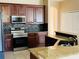 Gourmet kitchen with stainless steel appliances and granite countertops at 702 Palenci Ct, Winter Springs, FL 32708