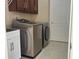 Well-equipped laundry room featuring a modern washer, dryer, and storage, enhancing convenience at 702 Palenci Ct, Winter Springs, FL 32708