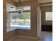 Light and bright living room with a view of the pool area at 702 Palenci Ct, Winter Springs, FL 32708