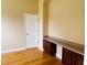A comfortable office area includes a built in desk, and a neutral paint color at 702 Palenci Ct, Winter Springs, FL 32708