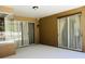 Covered patio with a ceiling light, outdoor speakers, and sliding glass doors to the pool area at 702 Palenci Ct, Winter Springs, FL 32708