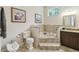 Bathroom featuring a soaking tub with tile surround, bidet, and wood vanity at 755 Cranes Court, Maitland, FL 32751