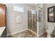 Bathroom featuring a glass shower, tile floors, and window at 755 Cranes Court, Maitland, FL 32751