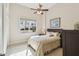 Bedroom features a ceiling fan, neutral walls, tiled floors and natural light at 755 Cranes Court, Maitland, FL 32751