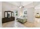 Bright bedroom with a large dresser, ceiling fan and tiled floors at 755 Cranes Court, Maitland, FL 32751