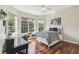 Bedroom featuring hardwood floors, neutral walls, a ceiling fan, and a window seat at 755 Cranes Court, Maitland, FL 32751