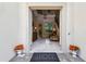 Inviting entryway featuring stone floors, elegant decor, and a glimpse of the staircase at 755 Cranes Court, Maitland, FL 32751