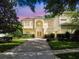Stately two-story home boasts a manicured lawn, paver driveway and lush landscaping for great curb appeal at 755 Cranes Court, Maitland, FL 32751