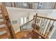 View of the foyer showcasing the staircase, railing, and double door entry to the home at 755 Cranes Court, Maitland, FL 32751