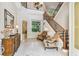 Spacious foyer features a soaring ceiling, elegant staircase, tiled floor, and natural light at 755 Cranes Court, Maitland, FL 32751