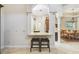 Open kitchen pass-through has a granite counter and barstool seating overlooking the adjacent dining room at 755 Cranes Court, Maitland, FL 32751