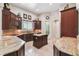Gourmet kitchen with granite countertops, custom cabinets, island, and modern appliances at 755 Cranes Court, Maitland, FL 32751