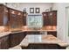 Gourmet kitchen with island, granite countertops, custom cabinets, stainless appliances, and ample sunlight at 755 Cranes Court, Maitland, FL 32751