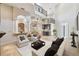 Open-concept living room with high ceilings, a bar, and an inviting seating arrangement at 755 Cranes Court, Maitland, FL 32751