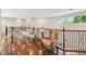 Loft area featuring hardwood floors and an ornate railing at 755 Cranes Court, Maitland, FL 32751