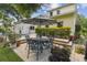 Outdoor patio with table and chairs surrounded by lush greenery, perfect for entertaining at 755 Cranes Court, Maitland, FL 32751