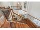 Staircase with wooden steps and wrought iron railings at 755 Cranes Court, Maitland, FL 32751