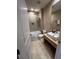 Modern bathroom featuring tiled walk-in shower and sleek vanity with contemporary fixtures, a luxurious retreat at 7567 Brooklyn Dr, Kissimmee, FL 34747