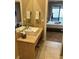 Modern bathroom featuring a contemporary vanity and sink with a view of the bedroom at 7567 Brooklyn Dr, Kissimmee, FL 34747