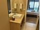 Modern bathroom featuring a contemporary vanity and sink with a view of the bedroom at 7567 Brooklyn Dr, Kissimmee, FL 34747
