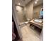Modern bathroom features a spacious walk-in shower and a stylish vanity with contemporary fixtures, offering a luxurious retreat at 7567 Brooklyn Dr, Kissimmee, FL 34747