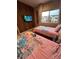 Charming bedroom with princess themed bedding and a wall mounted TV, perfect for a fun and imaginative space at 7567 Brooklyn Dr, Kissimmee, FL 34747