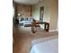 Cozy bedroom featuring a comfortable seating area with a plush couch, complemented by a stylish wooden desk and wall decor at 7567 Brooklyn Dr, Kissimmee, FL 34747