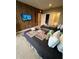 Unique bedroom featuring themed bedding, mounted TV, and wood accent wall, creating a fun and imaginative space at 7567 Brooklyn Dr, Kissimmee, FL 34747