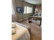 Comfortable bedroom featuring cozy seating and mounted television at 7567 Brooklyn Dr, Kissimmee, FL 34747