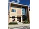 Striking contemporary home featuring large windows, a modern design, and manicured landscaping for curb appeal at 7567 Brooklyn Dr, Kissimmee, FL 34747