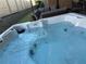 Close-up view of a luxurious hot tub filled with sparkling blue water, promising relaxation and hydrotherapy at 7567 Brooklyn Dr, Kissimmee, FL 34747