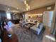 Bright and airy living room with stylish decor, plush seating, and open access to the kitchen at 7567 Brooklyn Dr, Kissimmee, FL 34747