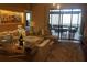 Comfortable living room with sliding glass doors to an outdoor patio area and modern décor at 7567 Brooklyn Dr, Kissimmee, FL 34747