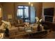 Cozy living room featuring a plush sofa, elegant decor, and a peaceful ambiance at 7567 Brooklyn Dr, Kissimmee, FL 34747