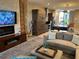 Open living space with modern fireplace, television, and easy kitchen access at 7567 Brooklyn Dr, Kissimmee, FL 34747