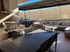 Outdoor dining and entertaining area with built-in grill, comfortable seating, and hot tub, ideal for relaxing and entertaining at 7567 Brooklyn Dr, Kissimmee, FL 34747