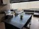 Inviting outdoor dining area with a large table, built-in grill, and comfortable seating, perfect for entertaining at 7567 Brooklyn Dr, Kissimmee, FL 34747