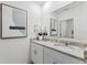 The bathroom features double sinks, a granite countertop, and modern fixtures at 786 Mocking Jay Ln, St Cloud, FL 34771