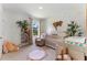 Adorable Bedroom featuring a crib, changing table, and charming decor at 786 Mocking Jay Ln, St Cloud, FL 34771