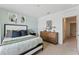 A light and airy bedroom features modern decor, stylish furnishings, and ample natural light at 786 Mocking Jay Ln, St Cloud, FL 34771
