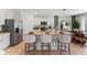 Kitchen featuring stainless steel appliances, granite countertops, and a center island with barstool seating at 786 Mocking Jay Ln, St Cloud, FL 34771